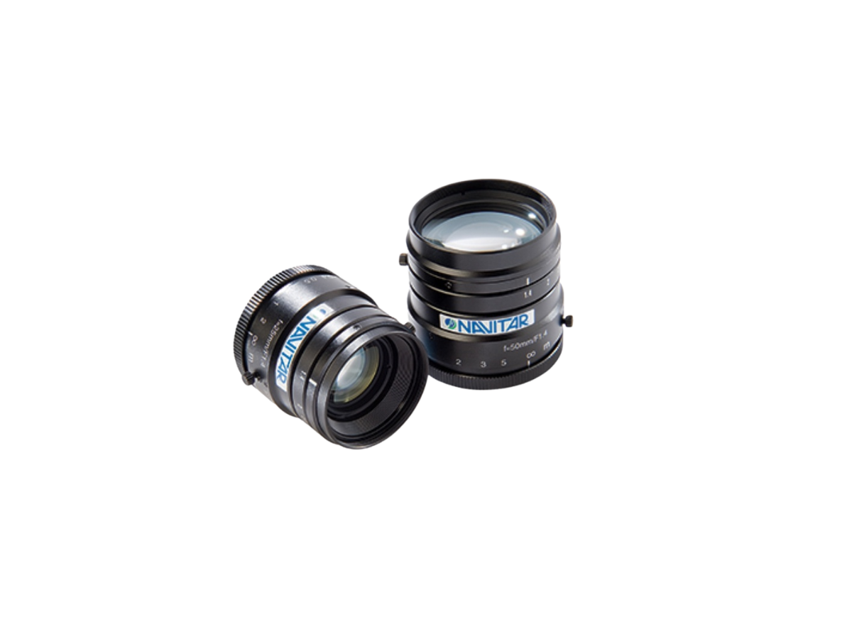 Two Navitar SWIR lenses, one sitting upright and one on it's side